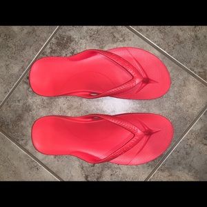 Hot pink Archies flip-flops